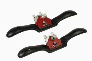 Two Stanley 12-951 cast-iron spokeshaves with black handles and red adjustable cutter housings on a white background.