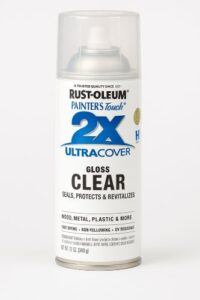 Rust-Oleum 2X Ultra Cover Gloss Clear spray paint can standing upright on a white background with a clear cap and printed label visible.